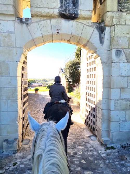 Entering castle of Amboise on our Loire castle horseback riding tours.